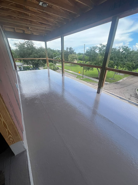 Finished waterproof fiberglass balcony deck with a smooth reflective coating