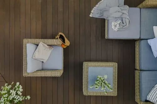 Overhead view of a finished waterproof balcony deck with outdoor furniture on Florida's Gulf Coast